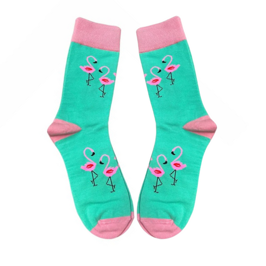 Mint green socks with dancing pink flamingos on white background