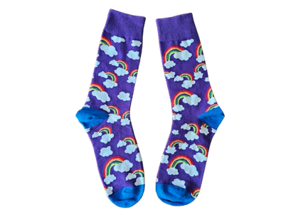 A pair of purple socks with a pattern of rainbows and fluffy clouds.