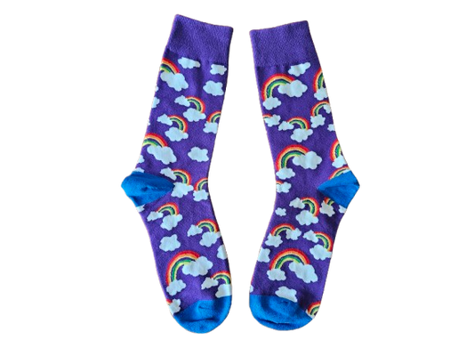 A pair of purple socks with a pattern of rainbows and fluffy clouds.