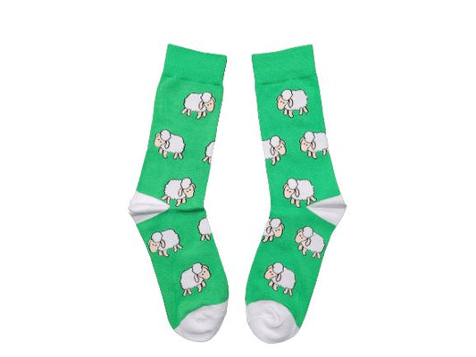 Bright green socks with cartoon sheep pattern on white background