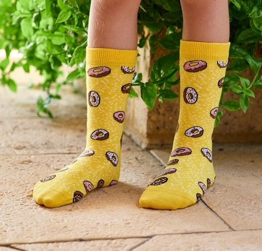 Yellow Donut Socks – crew-length kids socks with sweet treat design on sock model
